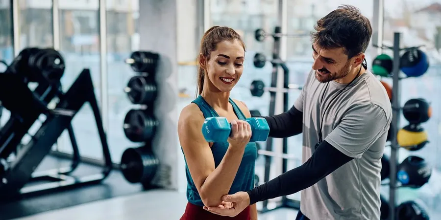 A personal trainer working with a client